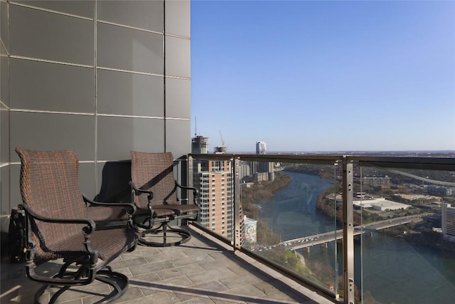 balcony featuring a water view