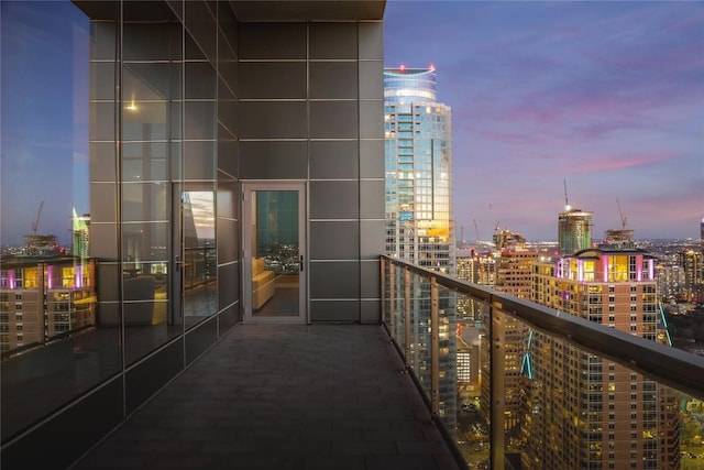 view of balcony at dusk