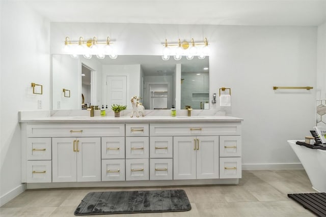 bathroom with vanity and shower with separate bathtub