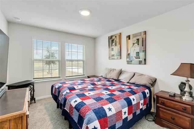 bedroom with light carpet