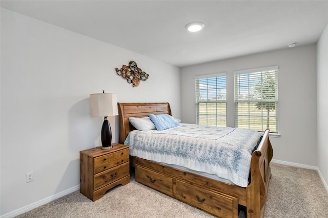 bedroom with light carpet