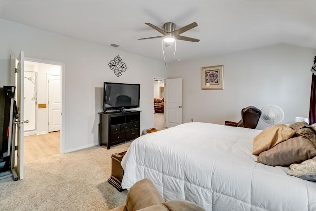 bedroom featuring ceiling fan, vaulted ceiling, and light carpet