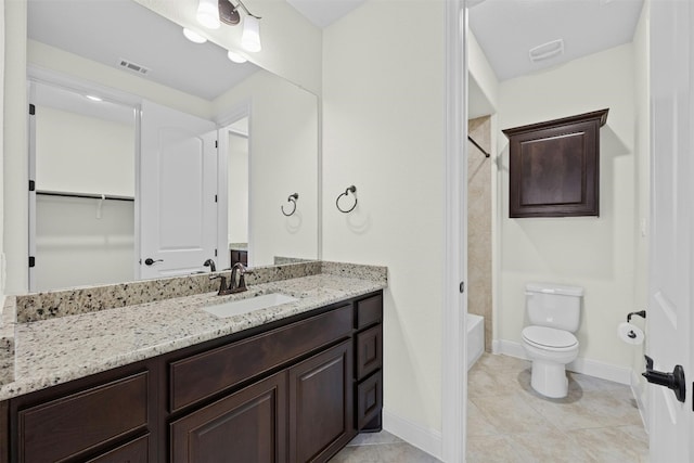 full bathroom featuring vanity, bathing tub / shower combination, tile patterned floors, and toilet