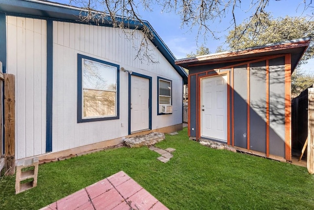 exterior space with a yard and a storage unit