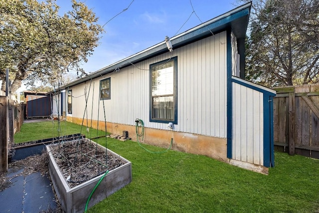 view of property exterior featuring a lawn