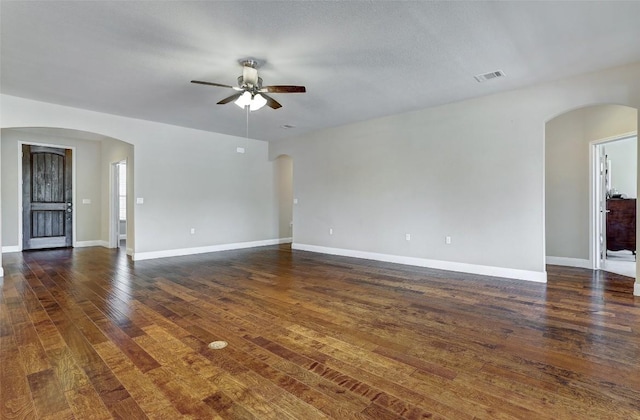 unfurnished room featuring dark hardwood / wood-style flooring and ceiling fan