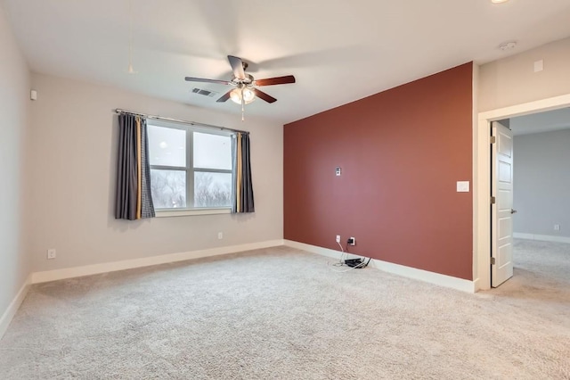 carpeted empty room with ceiling fan