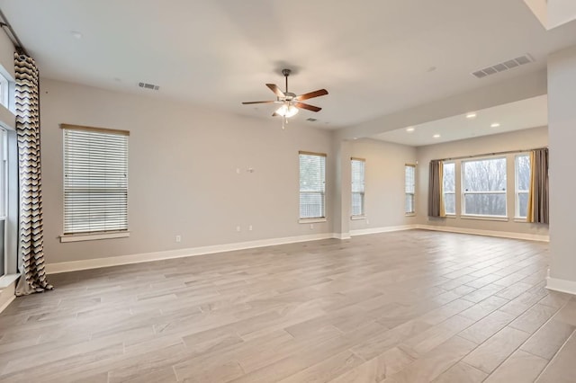 unfurnished living room with ceiling fan and light wood-type flooring