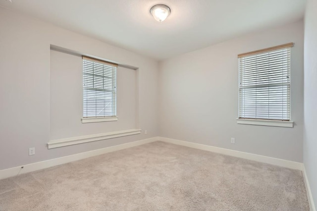 empty room featuring light carpet