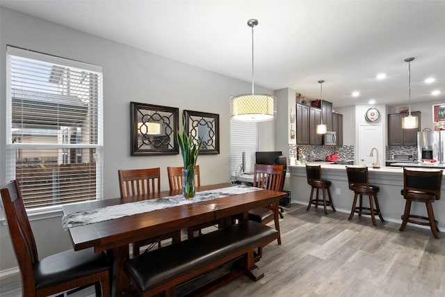 dining room with light wood-type flooring