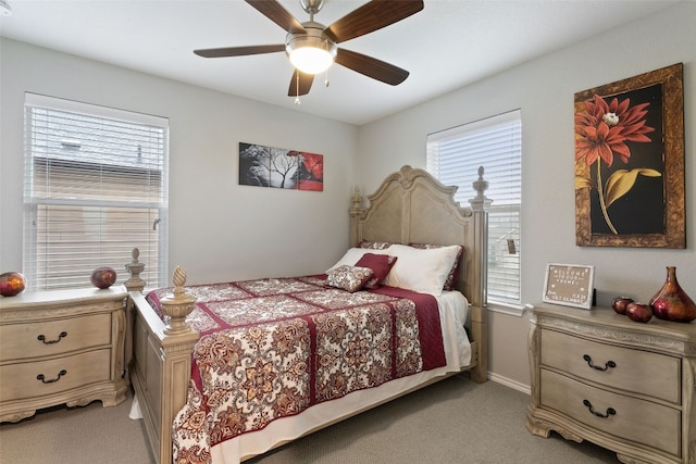 bedroom featuring ceiling fan and light colored carpet