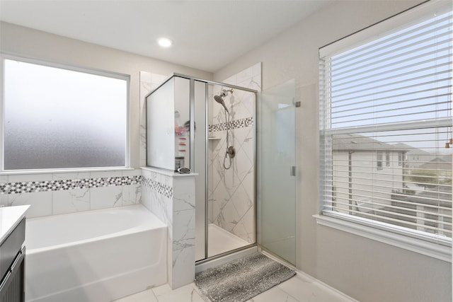 bathroom featuring independent shower and bath and vanity