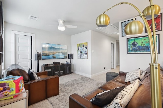 carpeted living room with ceiling fan