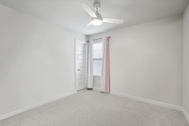 unfurnished room with light carpet and ceiling fan