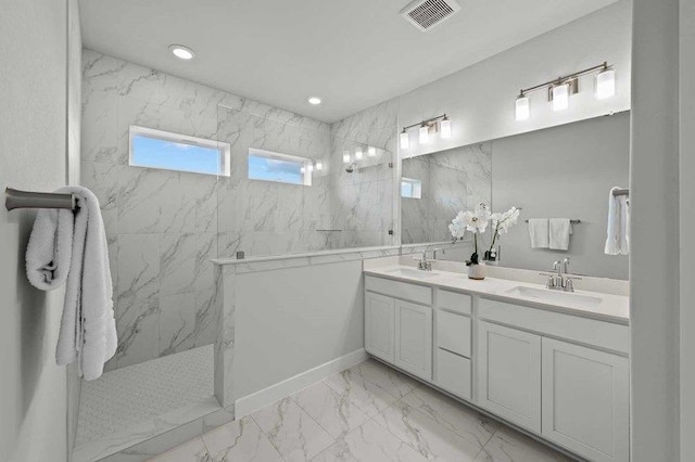 bathroom featuring vanity and a tile shower