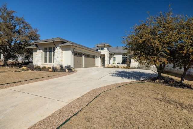 view of front of home with a garage and a front lawn