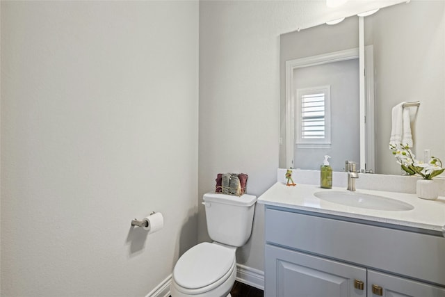 1005 Flint Ridge Trl, Georgetown, TX 78628 - half bath featuring baseboards, vanity, and toilet