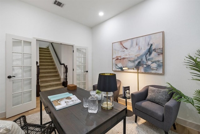 office space with hardwood / wood-style flooring and french doors