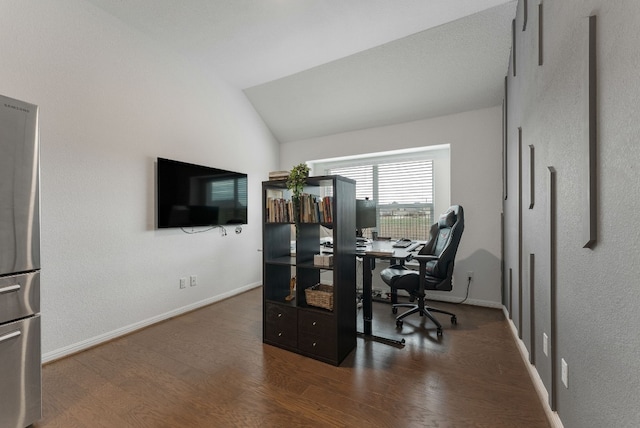 home office with lofted ceiling and dark hardwood / wood-style floors