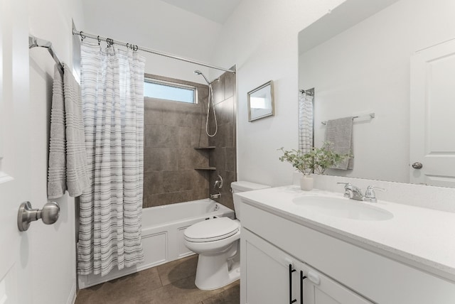 full bathroom featuring vanity, shower / tub combo with curtain, tile patterned floors, and toilet