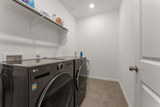 washroom featuring washing machine and dryer