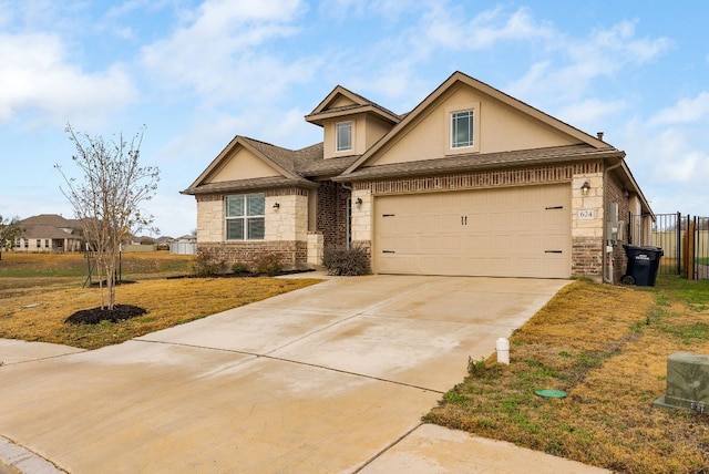 view of front facade with a garage and a front yard