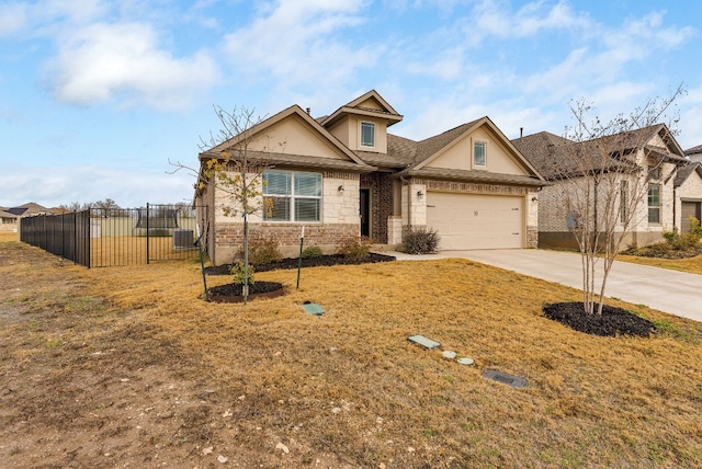 craftsman-style house featuring a garage and a front yard