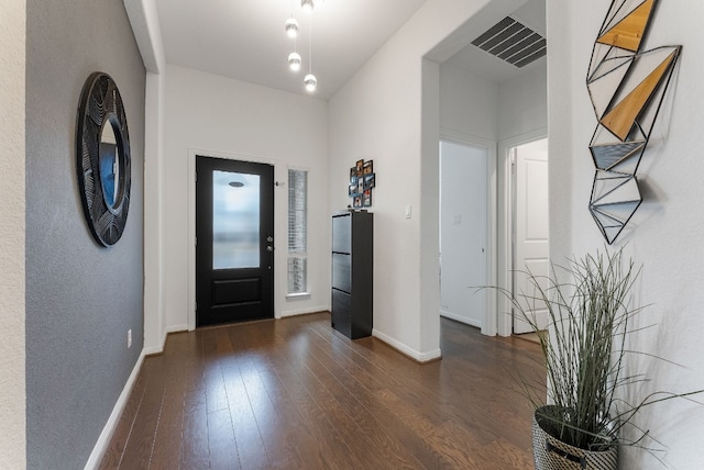 foyer entrance featuring dark hardwood / wood-style flooring