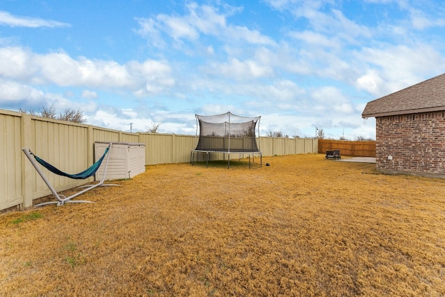 view of yard featuring a trampoline