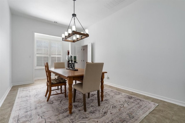 dining space with an inviting chandelier