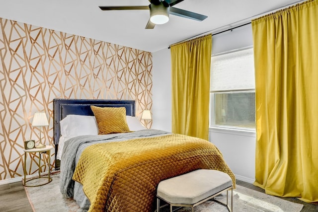 bedroom with wood-type flooring and ceiling fan