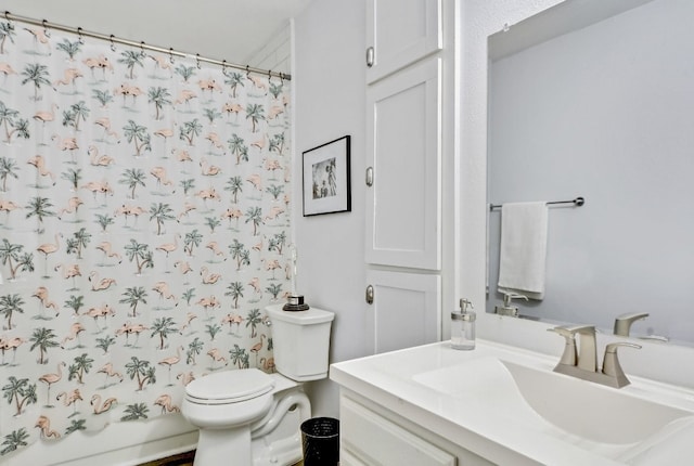 full bathroom featuring vanity, shower / tub combo with curtain, and toilet