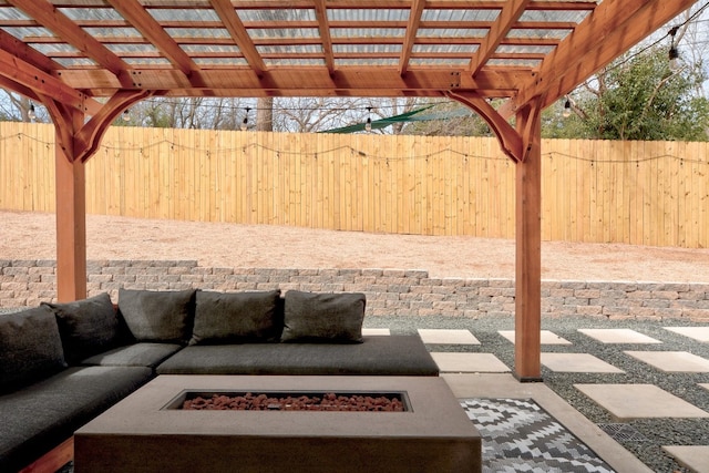 view of patio with a pergola and an outdoor living space with a fire pit