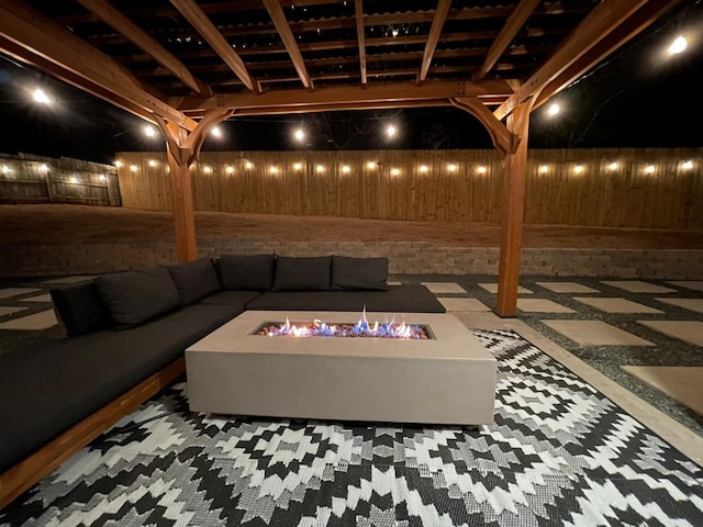 view of patio / terrace with an outdoor living space with a fire pit