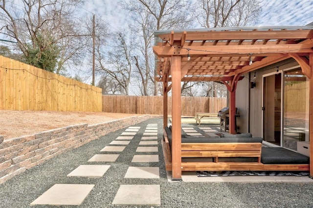 view of patio / terrace with grilling area and a pergola