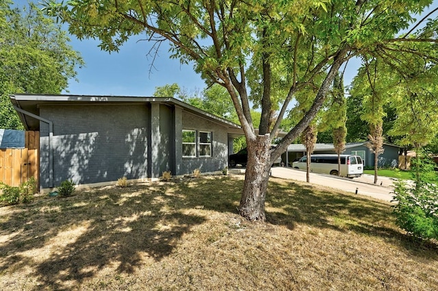 view of home's exterior featuring a lawn