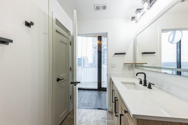 bathroom featuring tile patterned floors and vanity