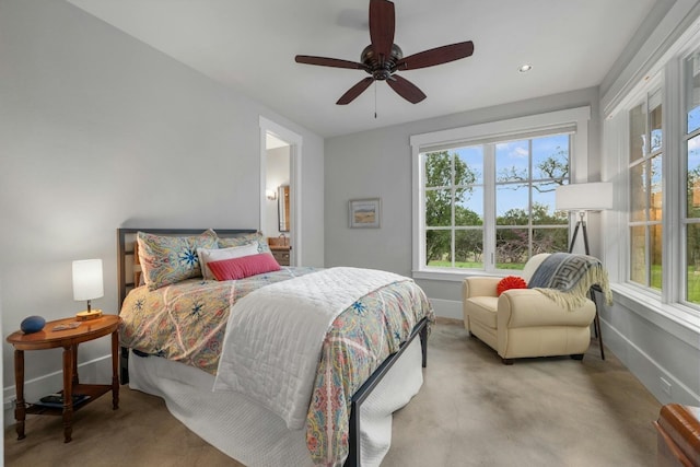 bedroom with ceiling fan, carpet floors, and baseboards