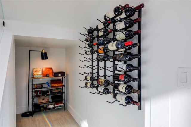 wine room with wood-type flooring