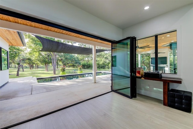 doorway with hardwood / wood-style floors