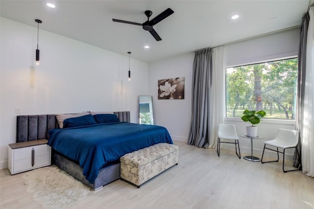 bedroom featuring hardwood / wood-style flooring and ceiling fan