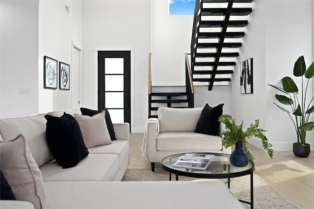 living room featuring a high ceiling