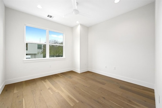 unfurnished room featuring hardwood / wood-style flooring and ceiling fan