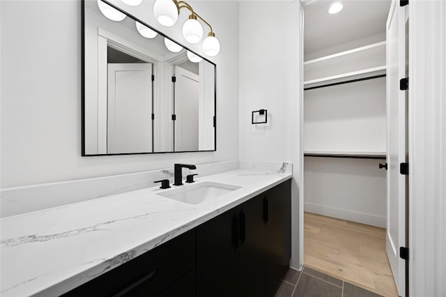 bathroom featuring hardwood / wood-style flooring and vanity