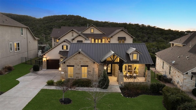 view of front of home featuring a patio and a lawn