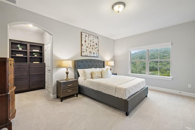 bedroom with light colored carpet