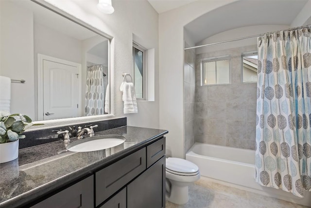 full bathroom with vanity, shower / tub combo, tile patterned floors, and toilet