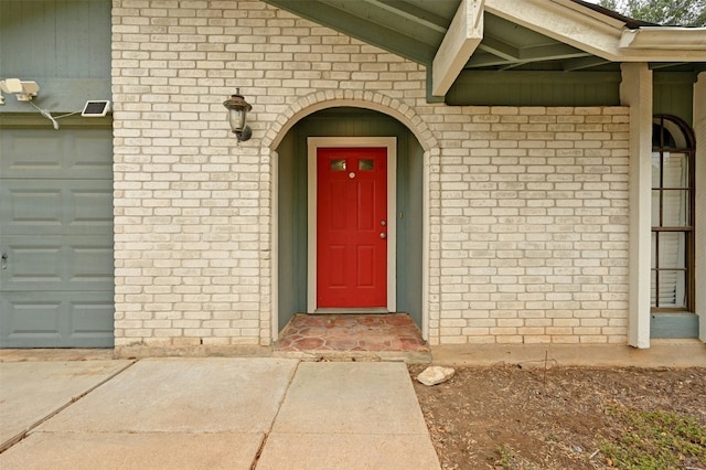 property entrance with a garage