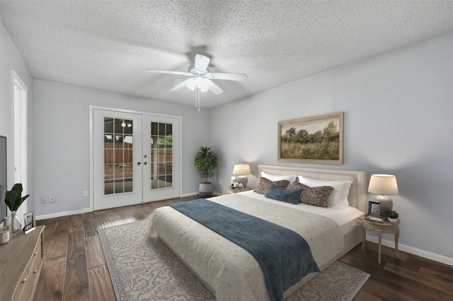 bedroom featuring access to exterior, ceiling fan, dark wood-type flooring, a textured ceiling, and french doors