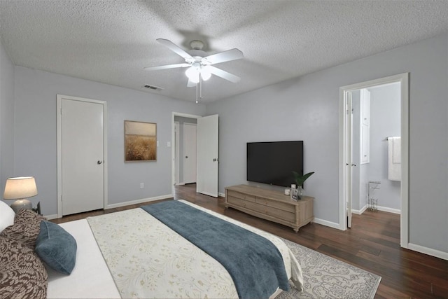 bedroom featuring ceiling fan, a textured ceiling, and dark hardwood / wood-style flooring